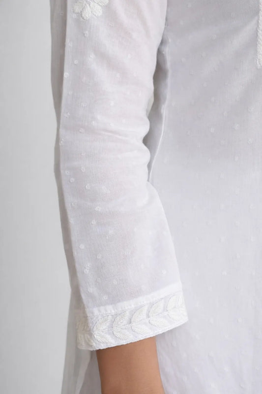 Close-up of white cotton Chikankari kurti sleeve with fine hand embroidery, Chikankari Sleeve Hand Embroidery Detail
