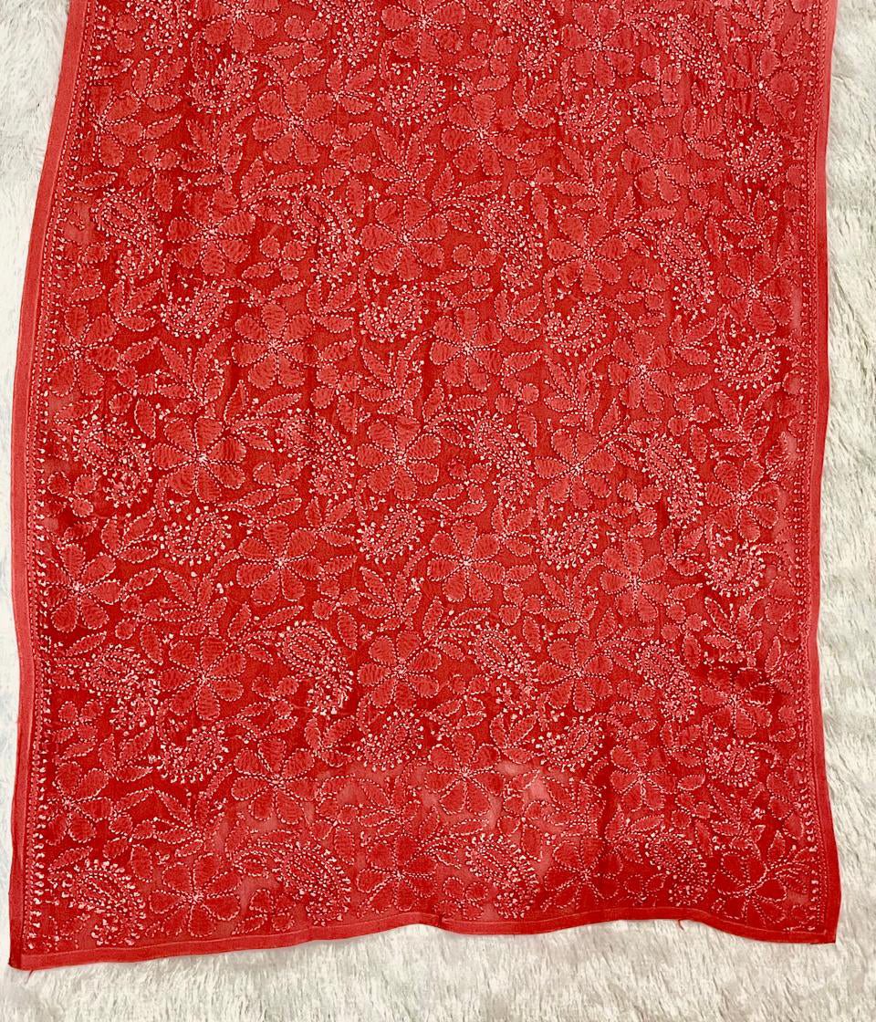 Pink fabric with white floral pattern embroidery detail