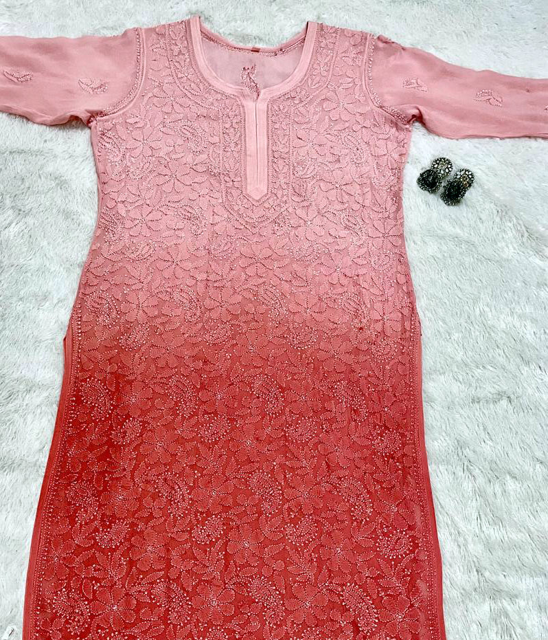 Pink embroidered viscose resham kurti on a textured white surface