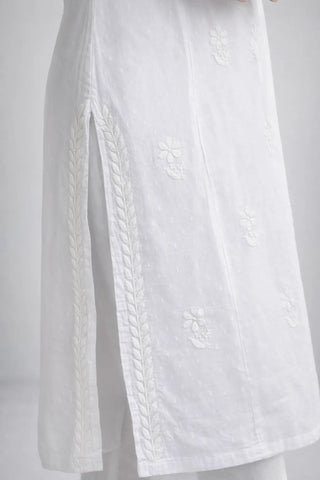 Side slit detail of white cotton Chikankari kurti with hand embroidery